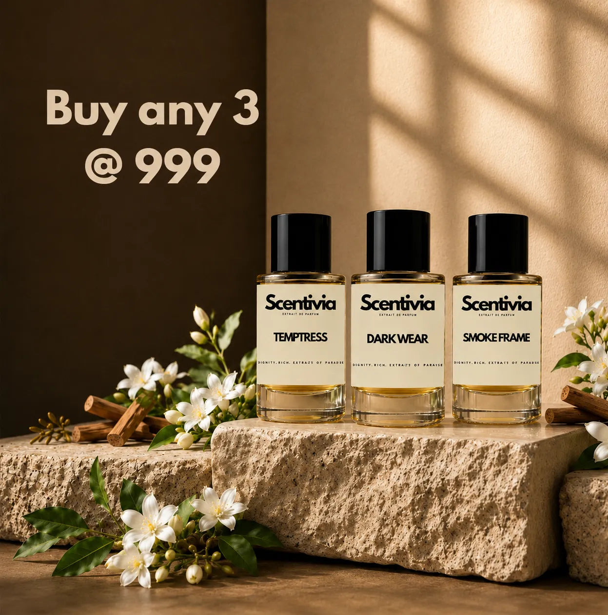 Scentivia perfume offer banner reading 'Buy any 3 @ 999'. Features Temptress, Dark Wear, and Smoke Frame bottles on a stone block with white flowers.