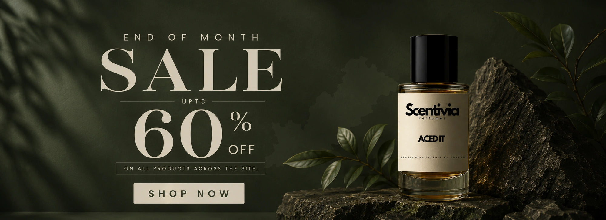 An End of Month Sale banner for Scentivia Perfumes offering up to 60% off across the site, featuring the "Aced It" fragrance bottle on a rustic rock with green leaves.