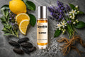 Blueprint roll on bottle with lemon slices, lavender, white blossoms, vanilla beans, sea salt crystals and vetiver roots