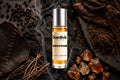 Smoke Frame roll on bottle with Black Pepper, Tobacco leaves, Leather, Vetiver roots and Amber crystals on smoky dark background