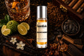 Sugar Daddy roll on bottle with Bergamot, Lime, Vanilla pods, Tobacco, Oud wood and Amber crystals on dark marble background