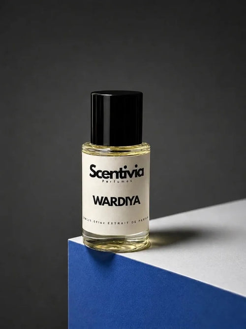 Perfume bottle with black cap and beige label reading WARDYA